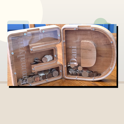 Clean staged wooden letter coin banks by Vega Woodwork