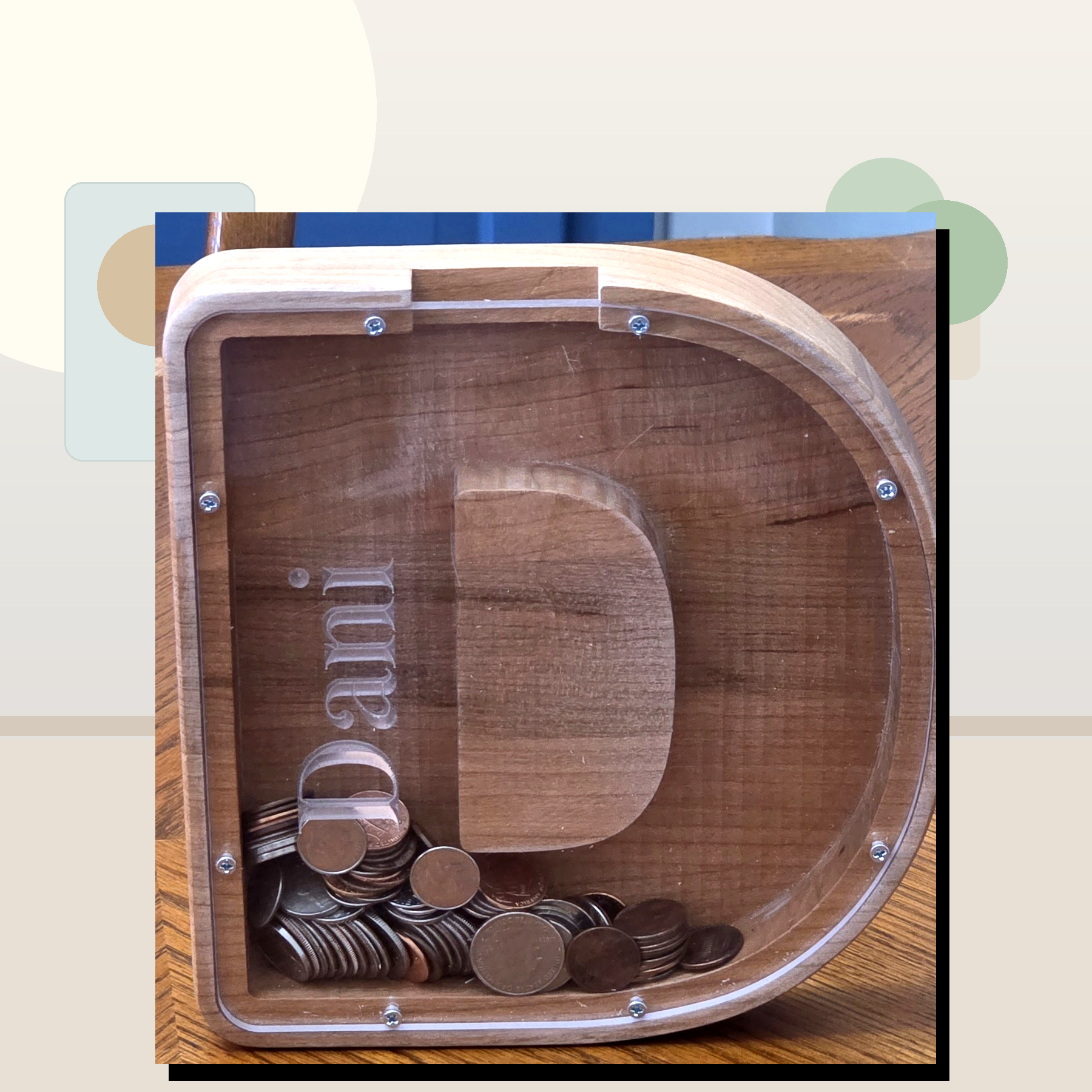 Clean staged wooden letter D coin bank by Vega Woodwork