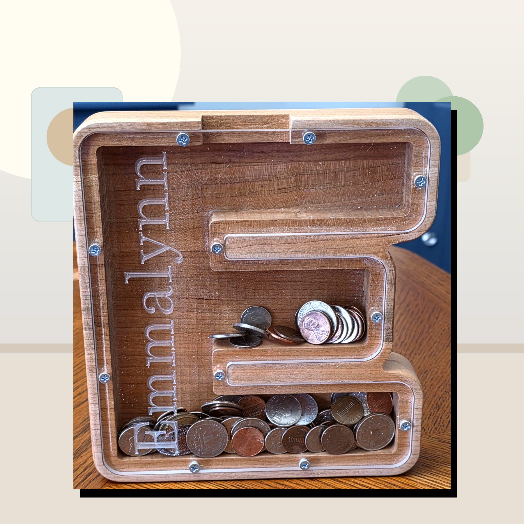 Clean staged wooden letter E coin bank by Vega Woodwork